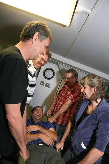Instructor coaching CPR compressions
